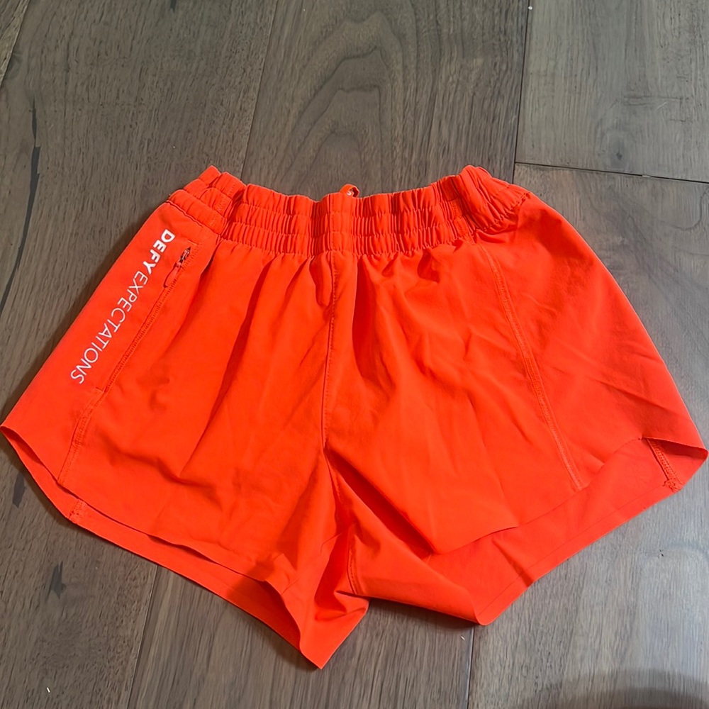 Athelta girls size medium-8/10 defy expectations orange shorts